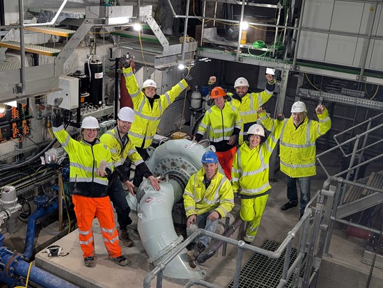 Cannot view this image? Visit: https://images.newsfilecorp.com/files/11736/282846_rheenergise_team_beside_the_turbine_550.jpg